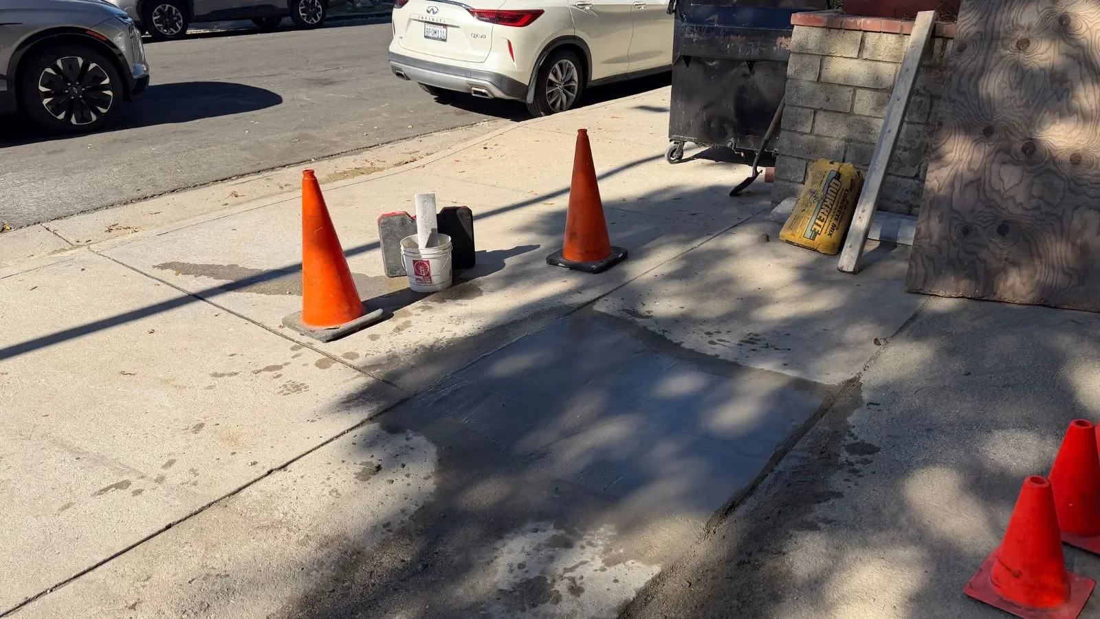 Completed Tujunga sewer line repair with excavation prepared for backfill and sidewalk restoration